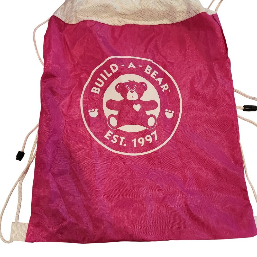 Build-A-Bear Workshop pink drawstring toy carrier backpack.